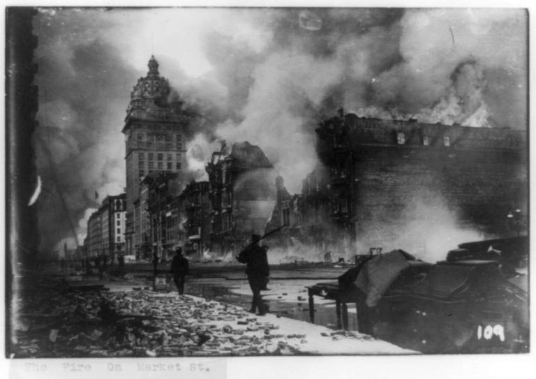 Black and white photograph of buildings burning on Market Street after the 1906 San Francisco earthquake.